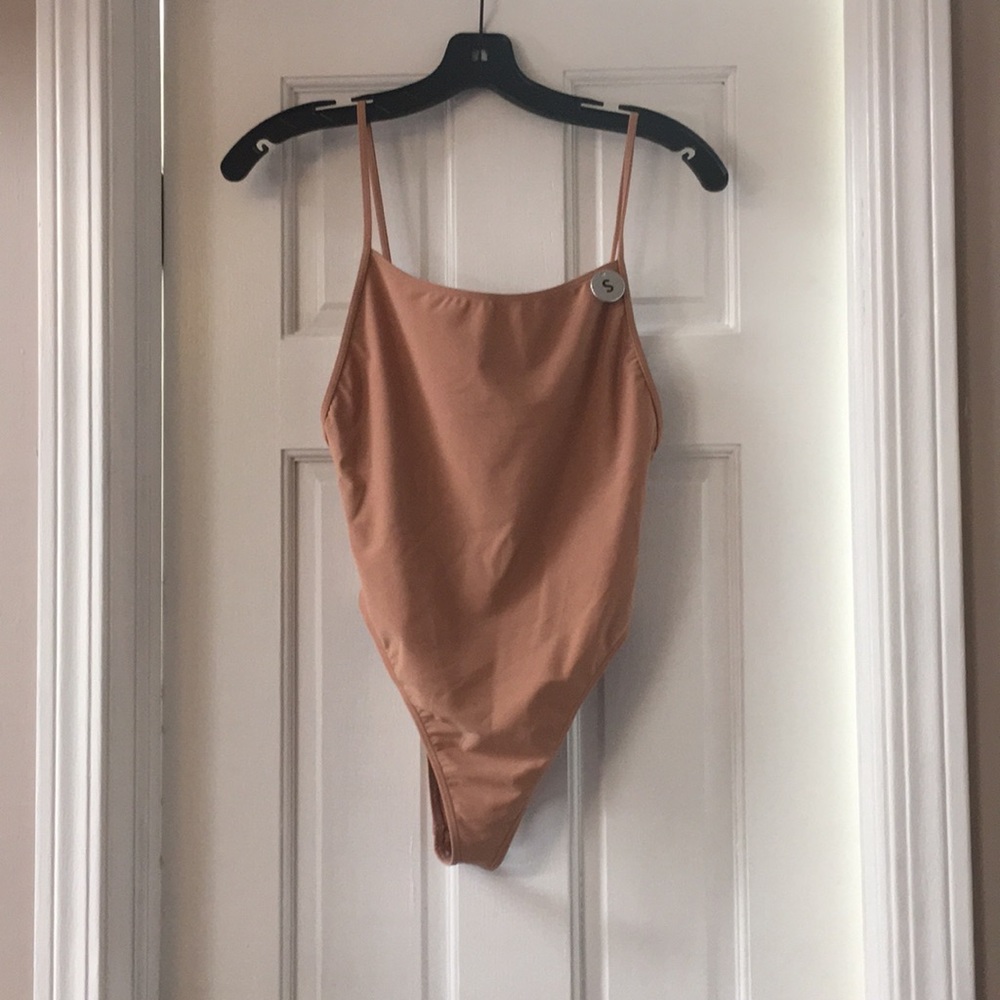 Pink/nude bathing suit.